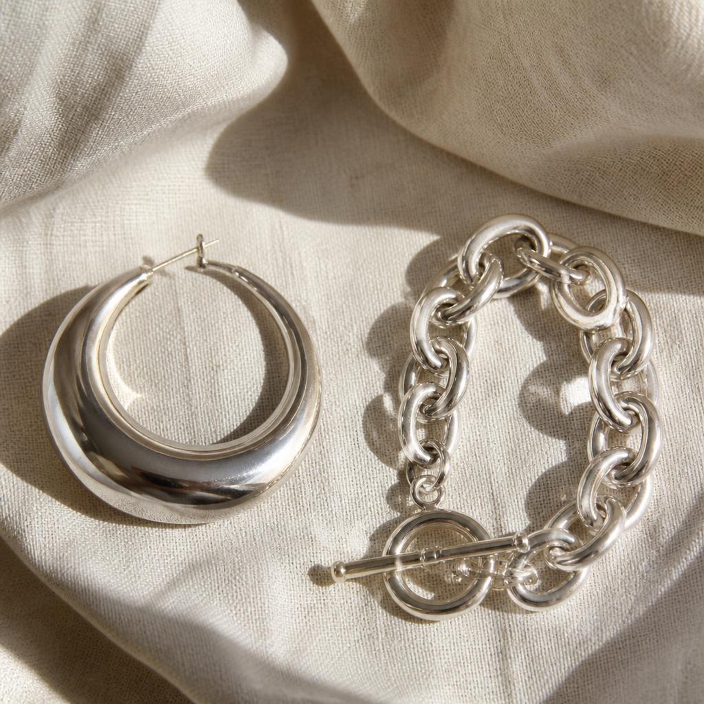 Statement silver hoop earring and chunky silver chain bracelet